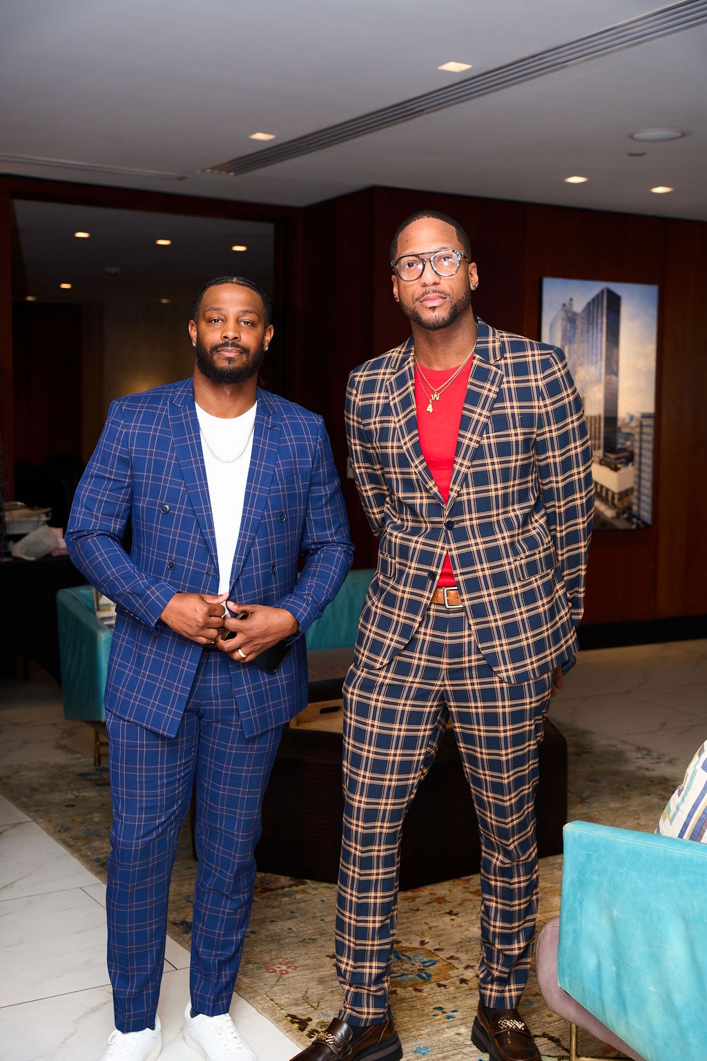 Two guests in plaid suits dressed in fall cocktail chic attire at Dinner Society Vibesgiving
